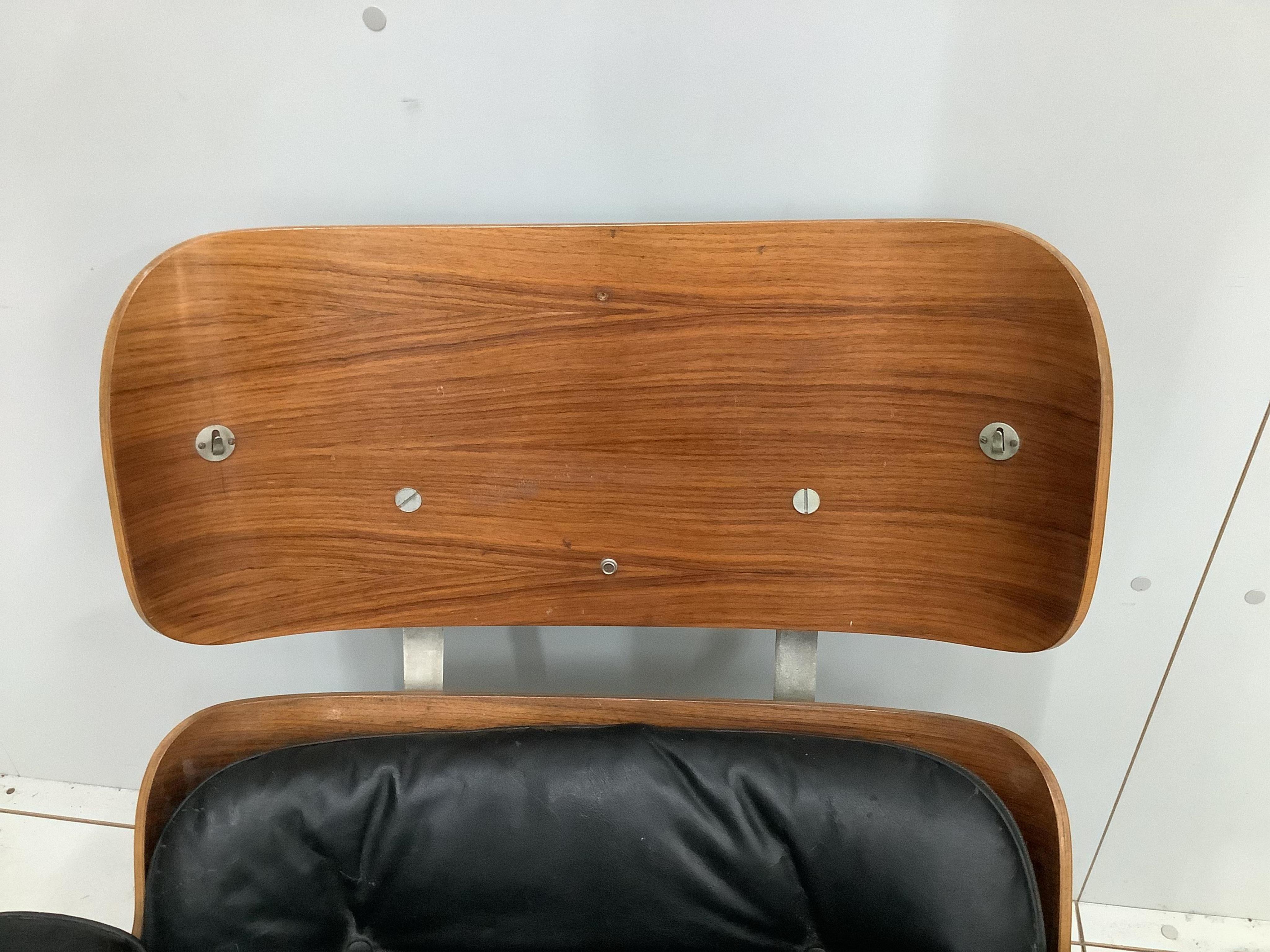 A Charles & Ray Eames for Herman Miller lounge chair, model 670, width 83cm, depth 90cm, height 80cm. Condition - poor